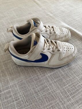 Nike Kids White Sneakers with Blue Swoosh